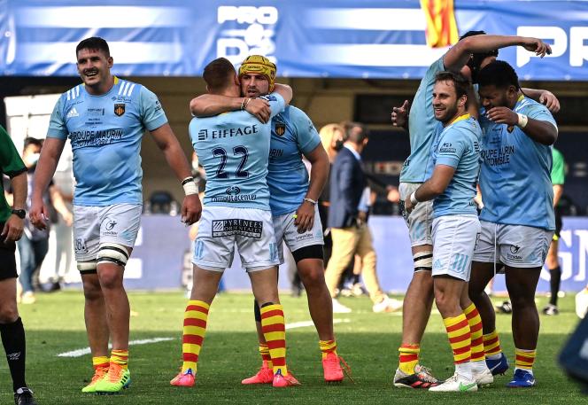 Perpignan players celebrate their victory over Biarritz on Saturday 5 June.