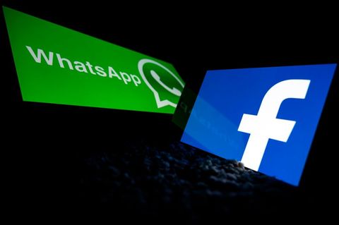 This image taken on October 5, 2020 shows the logo of the social network Facebook and the mobile messaging service WhatsApp on smartphone and tablet screens in Toulouse, southwest France, Lionel Bonaventure afp Image of Lionel Bonaventure via Getty Images