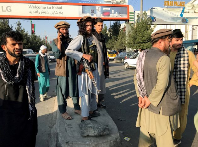 The Taliban patrol in front of Hamid Karzai International Airport in Kabul...