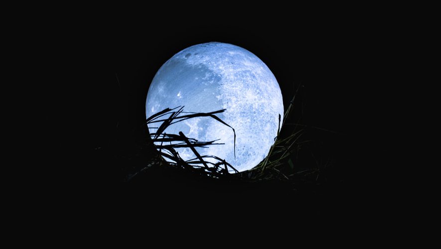 What is a blue moon, a notable astronomical phenomenon scheduled to occur on Sunday?