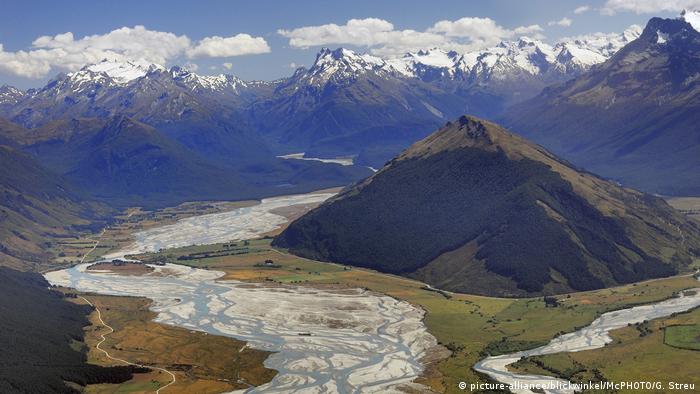 An aerial view of the Dart River Valley with the Dart River and surrounding Forbes Mountains in the background