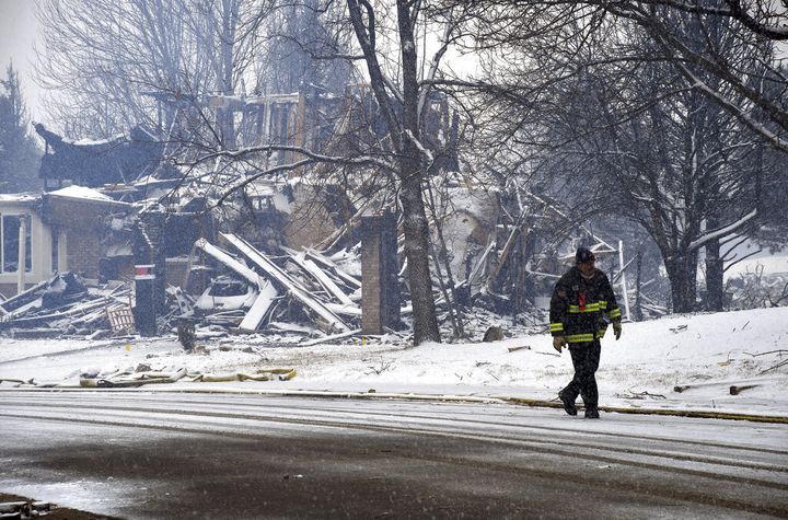 A man in Superior, Colorado, after a fire and snowfall on December 31, 2021 (THOMAS PEIPERT/AP)