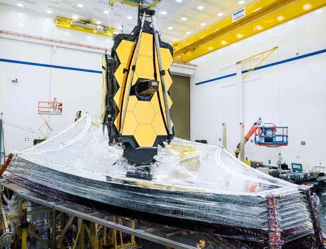 This (undated) image released by NASA shows the James Webb Telescope being prepared for launch.  The US space agency deployed the telescope's canopy on January 4, 2022.
