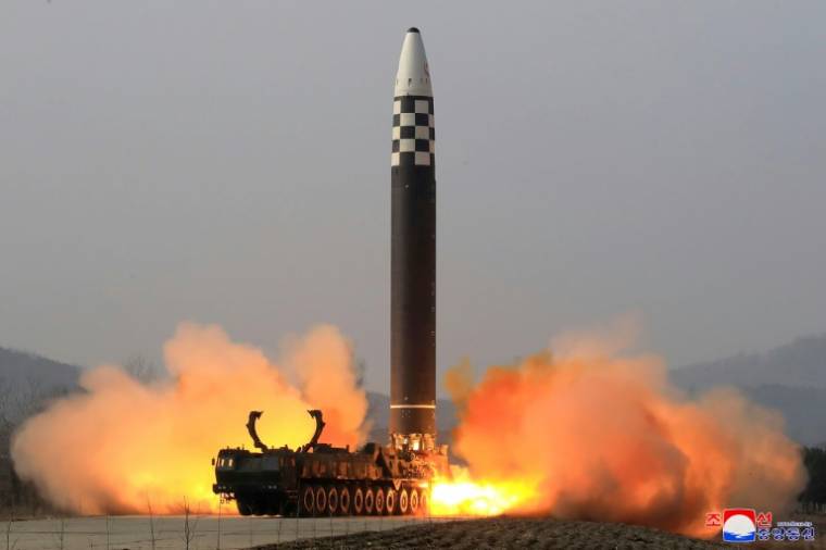 A photo released by North Korea's Kcna Agency on March 25, 2022 of the launch of a Hwasong-17 ICBM at an unspecified location in North Korea on March 24, 2022 (KCNA VIA KNS/STR)