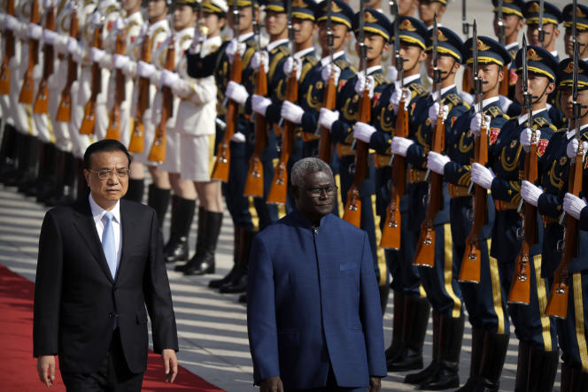 Chinese Premier Li Keqiang, left, and Solomon Islands Prime Minister Manasseh Sogavari during a welcoming ceremony at the Great Hall of the People in Beijing on Wednesday, October 9, 2019.