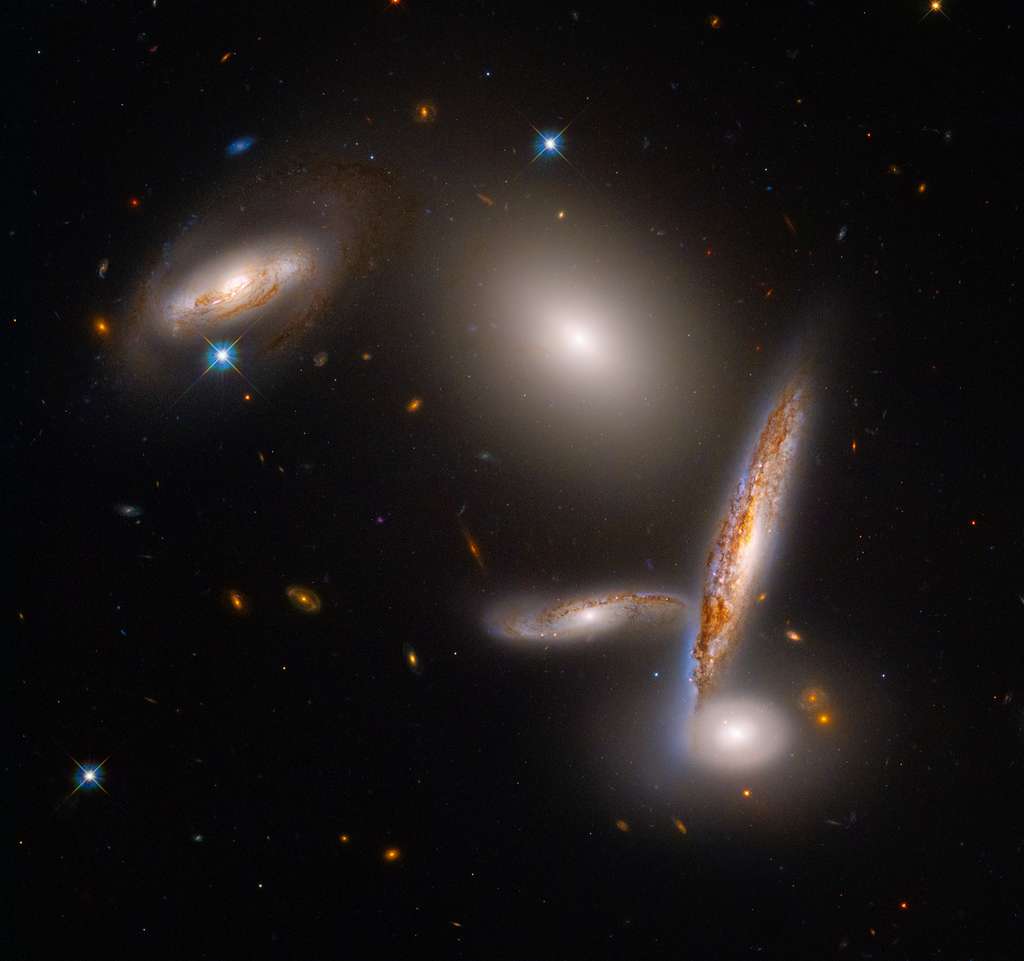 These five galaxies are trapped in a halo of dark matter that forces them to get closer to each other, until they collide.  Download the image for printing (28.6MB).  © NASA, ESA, STScI, Alyssa Pagan