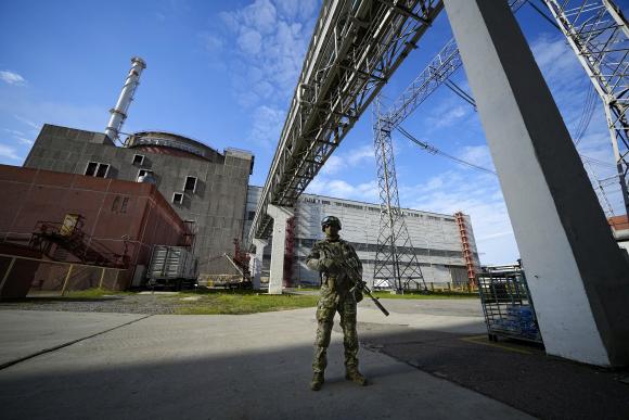 A Russian soldier guards an area at the Zaporizhia Nuclear Power Plant on May 1, 2022.