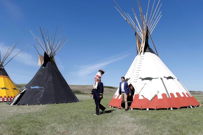 Canadian Prime Minister Justin Trudeau and Sexica Nation President Orai Croft exit a tip-wagon, at the Continental Flats in Alberta, Canada.  June 2, 2022.