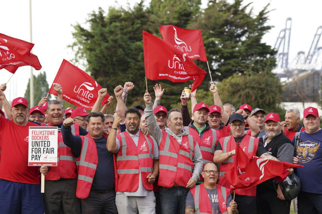 Members of the Unite union sit at one of the entrances to Felixstowe Harbor in Suffolk, in exchange for a wage increase, Sunday, August 21, 2022.