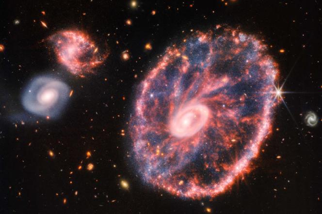 Composite image taken with the James Webb Space Telescope, showing the Cartwell Wheel Galaxy and its companion galaxies.