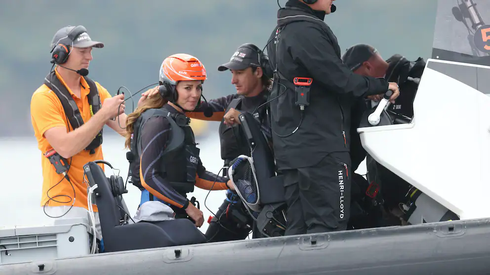 Duchess Kate competes in a wetsuit sailing race