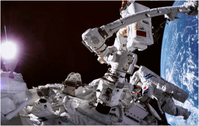Chinese astronauts walk into space from their new station (video)