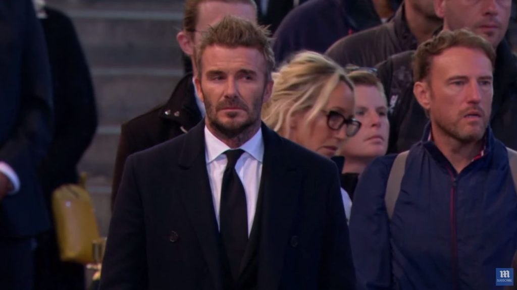 David Beckham meditating in front of the coffin after more than 13 hours of queuing