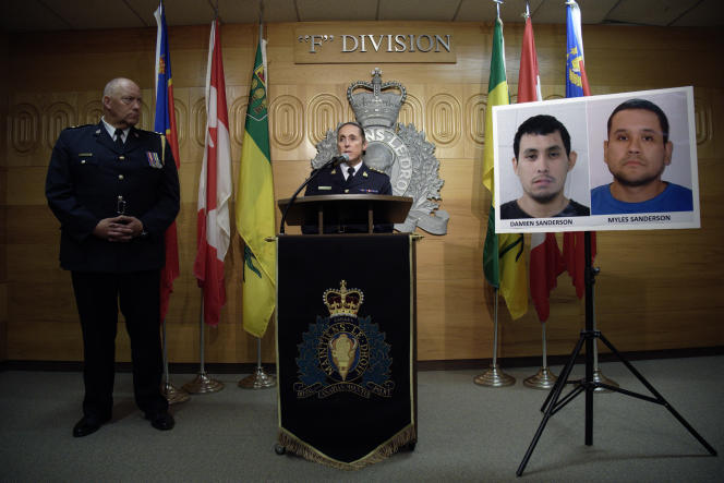 Royal Canadian Police Assistant Commissioner Rhonda Blackmore at a press conference in Regina, Saskatchewan, September 4, 2022, with photographs of the two suspects in the knife attacks that occurred earlier in the day.