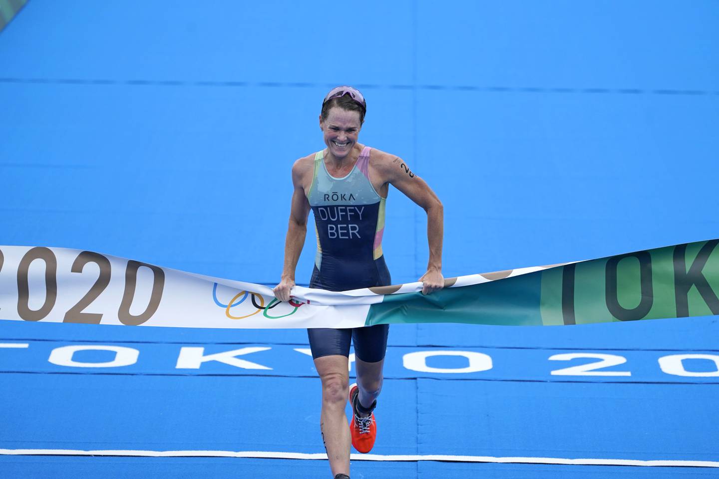 Flora Duffy crosses the finish line to win triathlon gold at the 2020 Tokyo Olympics. PA