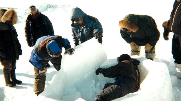 Students learn to build an igloo, April 2002.